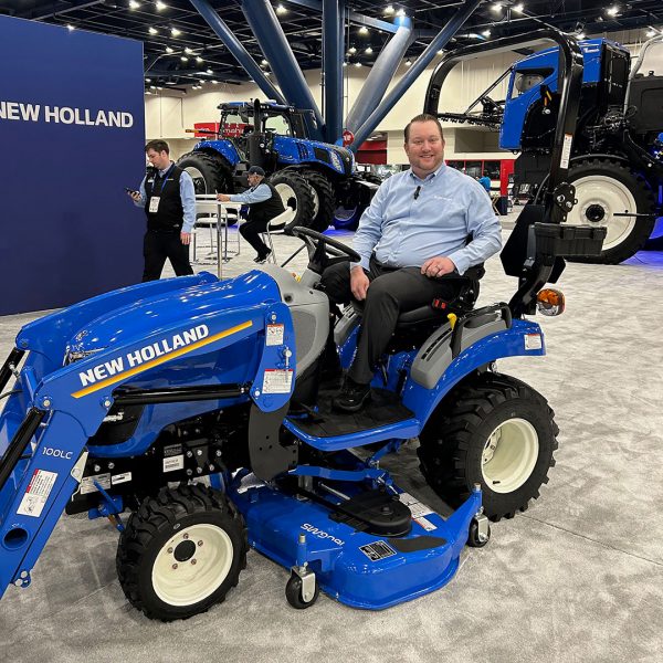 Bill Brozak on a New Holland tractor at Commodity Classic.